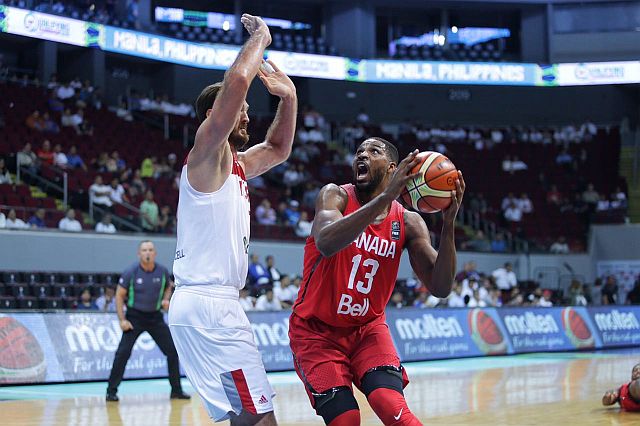 Canada’s Tristan Thompson maneuvers in the paint against a Turkey defender at the start of the Fiba Olympic Qualifying Tournament in Manila at the Mall of Asia Arena last night. (INQUIRER.NET)
