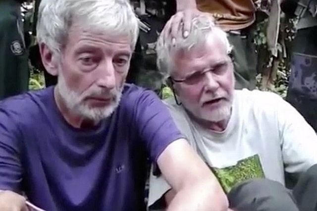 This file image made from undated militant video shows Canadians Robert Hall (left) and John Ridsdel. Militant Video via AP FILE VIDEO