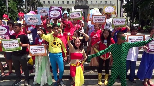Members of militant groups don superhero costumes to protest Pres. Rodrigo Duterte’s plan to grant former president Ferdinand Marcos a hero’s burial. 
