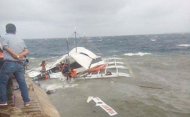 Ten passengers and three boatmen were rescued after strong waves caused the motorboat they were on to capsize. (CDN PHOTO/NORMAN MENDOZA)