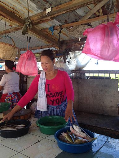 Mandaue City wet market vendors like fish vendor Belen Bacarisa (right photo) will start to lessen their use of plastic bags as they sell their fish and other vegetables with the strict implementation of the plastic ban starting today (Monday). (CDN PHOTO/ JULIT JAINAR)