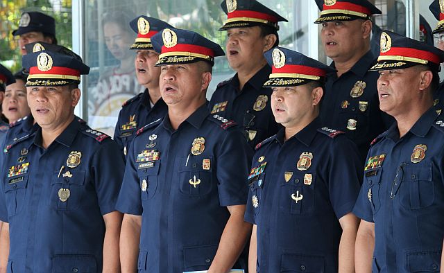 NEW POLICE DIRECTORS: The newly appointed police directors (L-R) Senior Supt. Roberto P. Alanas for Mandaue, Senior. Supt. Rommel Bernardino A. Cabagnot for Lapu-Lapu, Senior. Supt. Joel B. Doria for Cebu City and Senior Supt. Jose B. Macanas for Cebu Province, attend the turnover of command ceremony at Camp Sergio Osmeña Sr. (CDN PHOTO/JUNJIE MENDOZA)