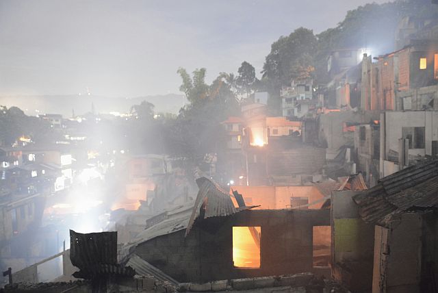 At least 50 houses were razed in an early evening fire in Barangay Capitol Site. Fire victims are now housed at the Capitol Site Gym. (CDN PHOTO/CHRISTIAN MANINGO)
