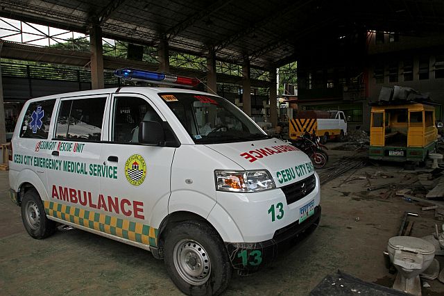 This Cebu City-issued ambulance is kept on standby at a village-owned garage in Barangay Agsungot. (CDN PHOTO/JUNJIE MENDOZA)