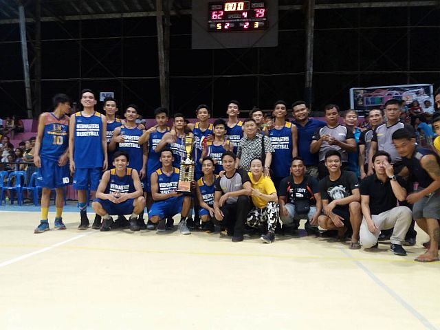 Members of the University of Cebu Baby Webmasters gather at center court after winning the title in the 1st Mayor Teche Sitoy-Cho basketball tournament. contributed