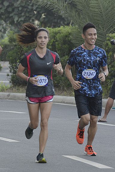 Ruffa Sorongon (left) and Azlan Pagay near the finish line during the 6th St. Ignatius Run.  (CDN PHOTO/CHRISTIAN MANINGO)