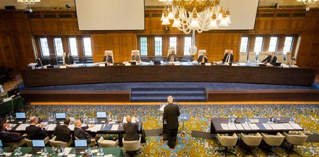 In this image released by the Permanent Court of Arbitration  on Tuesday, the case regarding the Philippines and China on the South China Sea is heard at the Permanent Court of Arbitration (PCA) at The Hague, the Netherlands. The tribunal ruled in a sweeping decision Tuesday  that China has no legal basis for claiming much of the South China Sea and had aggravated the seething regional dispute with its large-scale land reclamation and construction of artificial islands that destroyed coral reefs and the natural condition of the disputed areas. Clockwise from top left: Registrar and PCA Senior Legal Counsel Judith Levine; Judge Stanislaw Pawlak; Professor Alfred H. A. Soons; Judge Thomas A. Mensah (Presiding Arbitrator); Judge Jean-Pierre Cot; Judge Rudiger Wolfrum; PCA Senior Legal Counsel Garth Schofield; former Secretary for Foreign Affairs of the Philippines, Albert F. Del Rosario; former Solicitor General Florin T. Hilbay, Counsel for the Philippines; Paul S. Reichler; Professor Philippe Sands; Professor Bernard H. Oxman; Professor Alan E. Boyle; Lawrence H. Martin.  Permanent Court of Arbitration via AP
