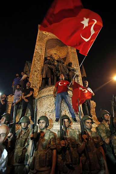 Turkish soldiers secure the area as supporters of Turkey’s President Recep Tayyip Erdogan protest in Istanbul’s Taksim square, early Saturday.