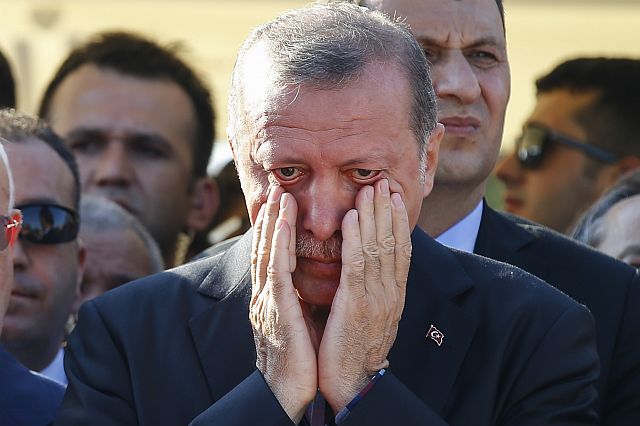 Turkish President Recep Tayyip Erdogan wipes his tears during the funeral of Mustafa Cambaz, Erol and Abdullah Olcak who were killed Friday while protesting the attempted coup against Turkey’s government in Istanbul Sunday.