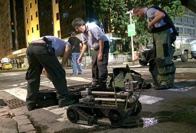 Members of Brazil’s security services pack away bomb disposal equipment following a controlled explosion in the Copacabana district of Rio de Janeiro on Tuesday. 