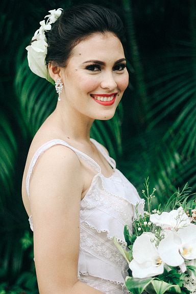 FANTASY WEDDINGS.  A fresh calla lily is styled as a hair accessory  to achieve an elegant couture wedding look.