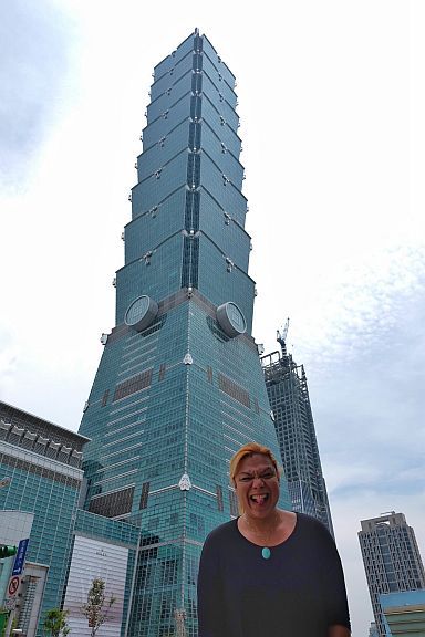 TAIPEI 101 and the touristy shot. Because the Fujinon 16mm lens is much wider than the 35mm, it allows this particular framing that fits the tallest building in the world (at least until 2009) into a tourist shot without having to walk too far away. 