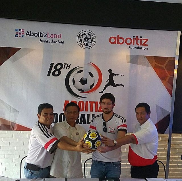 From left, Glenn Quisido, Pericles Dakay, Eduardo Aboitiz and Sonny Carpio join hands during a press launching of the 18th Aboitiz Football Cup at the Pueblo Verde in Mactan. (CDN PHOTO/CHRISTIAN MANINGO)