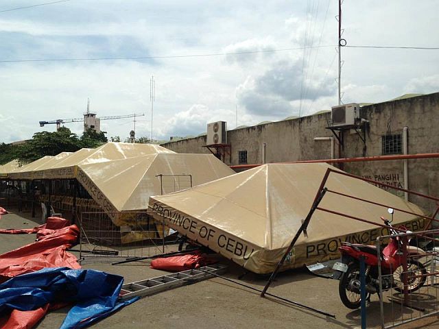 Passenger tents at the Cebu Bus Terminal were damaged by the sudden gust of wind on Friday. (CONTRIBUTED PHOTO)