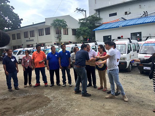 Gov. Hilario Davide III (fourth from left in white shirt) and Vice Gov. Agnes Magpale (third from left) led the distribution of the mini ambulances and motorcycles to the different municipalities and cities on Friday. (CDN PHOTO/JOSE SANTINO S. BUNACHITA)
