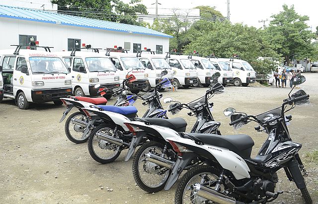 The mini-ambulances and motorcycles are readied for distribution to the different barangays in Cebu province at the Capitol grounds.  (CDN PHOTO/CHRISTIAN MANINGO)