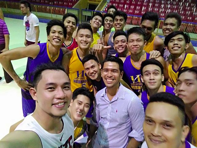 CALM BEFORE THE STORM. Newly installed University of Cebu head coach Kern Sesante (in long sleeves)  goofs around with his players in one of their tune-up games. (CONTRIBUTED PHOTO)