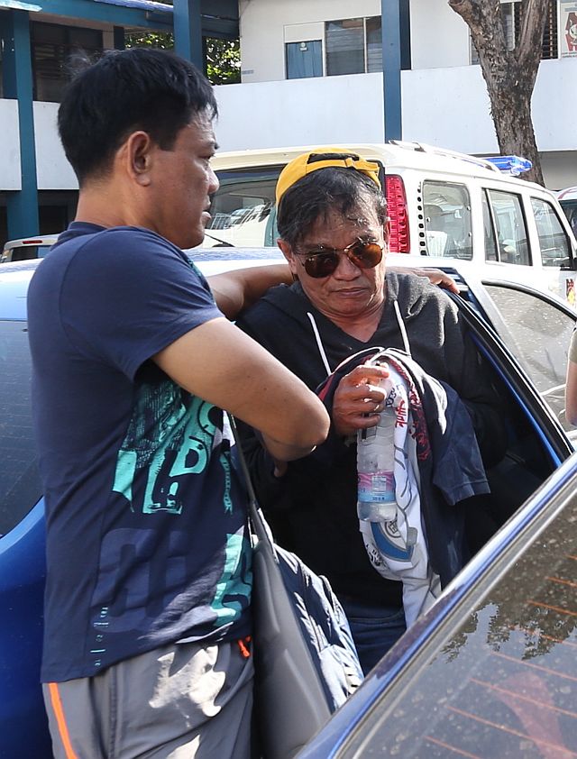 Roderic James “Ric-ric”  Espina (in dark glasses), an allege cohort of big-time drug lord Rolando “Kerwin” Espinosa Jr., was arrested by elements of the  Regional Special Operations Group (RSOG) in a pension house along Gen. Echavez St., Barangay Lorega after he was put under surveillance for bragging that he and Kerwin were friends. Police said they chanced upon packs of marijuana and shabu along with other contraband items inside Espina’s room. (CDN PHOTO/JUNJIE MENDOZA)