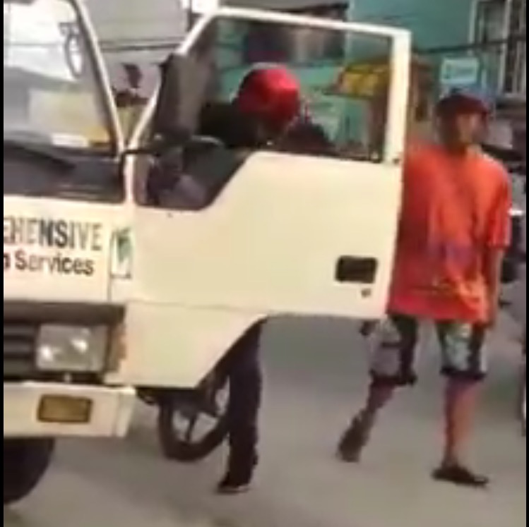 One of the men in the video kicked the driver while the other man in orange shirt was wielding a gun. (VIDEO GRABBED)