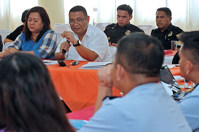 Nagiel Banacia (2nd from left), head of the Cebu City Disaster Risk Reduction and Management Office (CCDRRMO), outlines their preparations during the third quarter disaster preparedness meeting. (CDN PHOTO/JUNJIE MENDOZA)