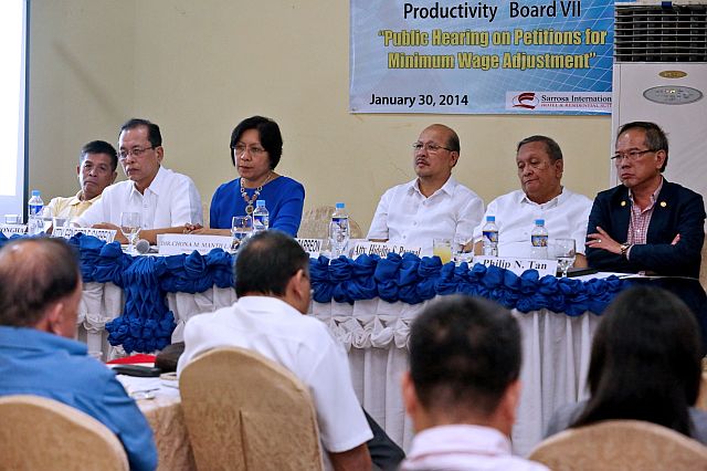 Jose Tumongha, (left), Ernesto Carreon (second from left), Hidelito Pascual (5th from left) and Philip Tan (right) have resigned from the wage board being presidential appointees of the previous administration. Above, the wage board during one of its sessions in 2014 (CDN FILE PHOTO).