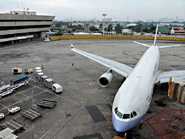 An aircraft sits at the tarmac of the Ninoy Aquino International Airport as it is readied for its next flight.