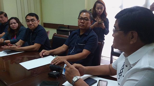Homer Mariano Cabaral, Napolcom Central Visayas director, served the resolution to Cebu City acting mayor Edgardo Labella on Wednesday. (CDN PHOTO/NESTLE L. SEMILLA)