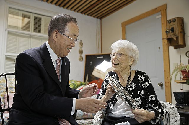UN Secretary-General Ban Ki-moon presents his 99-year-old “American Mom” Libba Patterson with an engraved silver platter before lunch at her home Thursday, Aug. 11, 2016, in Novato, California. 
