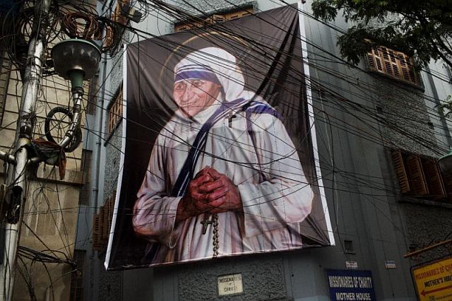 A giant picture of Mother Teresa is displayed outside the Missionaries of Charity Mother house in Kolkata, India, Saturday. (AP)