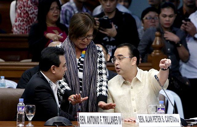 Committee Chair Leila De Lima pacifies Senator Alan Peter Cayetano and Senator Antonio Trillanes during the Senate probe on the alleged extrajudicial killings at the Senate in Pasay City.( INQUIRER PHOTO / RICHARD A. REYES) 
