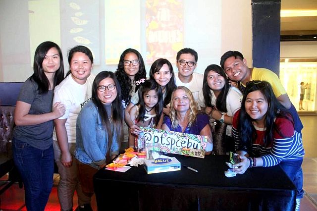 ANDREA (seated at the center) and fellow author Amy Zhang (3rd from left) connect with fans at the National Book Store book signing event held at SM City Cebu - Northwing.