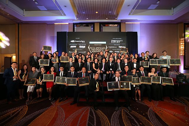 The winners of the 4th Philippine Property Awards show their plaques after the awarding ceremony in Manila (INQUIRER FILE PHOTO).