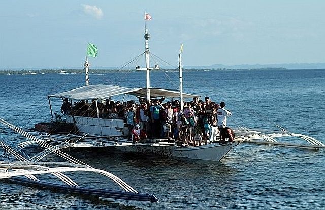 A motor banca that came from Olango Island prepares to dock at Angasil pier in Barangay Mactan in this file photo.  