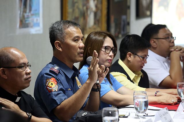 Senior. Supt. Rey Lyndon Lawas (2nd from left) discusses security plans for the convoy carrying the statue of the Blessed Virgin in Lindogan, Simala, Sibonga to Cebu City on  Oct. 7. With him are (from left) Rev. Fr. Jonas Mejares, Spiritual Director; Mary Ann Gonzalez and Mel Tadeo of Kapandesal  Cooperative and Rev. Fr. Ric Anthony Reyes  of the Basilica Minore Del Sto Niño (CDN PHOTO/JUNJIE MENDOZA).