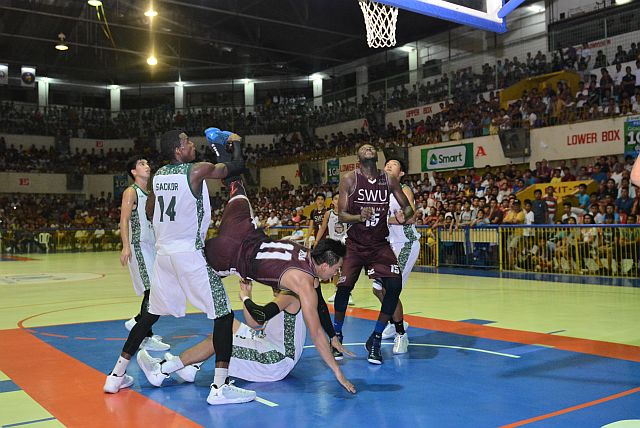 Tallo falls after being fouled by UV defenders. This was the play that motivated the two-time MVP to finish strong in their game at the jampacked Cebu Coliseum last Thursday. (CONTRIBUTED PHOTO/RON TOLIN). 