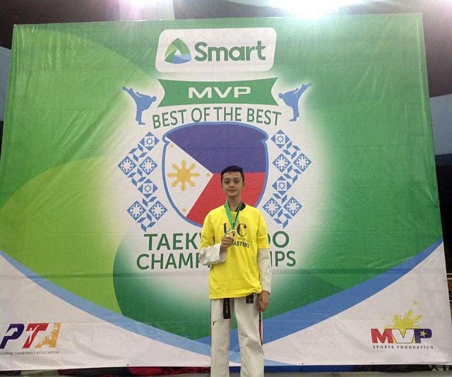 PROUD WEBMASTER. Dineson Caneda proudly shows his gold medal  garbed in UC’s official uniform during the awards ceremony of the 2016 MVP Best of the Best Taekwondo Championship in Pasay last Sunday (GRABBED FROM DINESON CANEDA'S FACEBOOK)