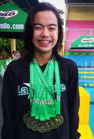 Lacson shows the 10 gold medals she harvested in the recent Milo Little Olympics Regional Finals at the Cebu City Aquatics Center.