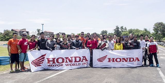 Participants of yesterday’s free safety clinic conducted by Honda Motors  at the Kartzone pose for a posterity shot.   (CDN PHOTO/CHRISTIAN MANINGO)