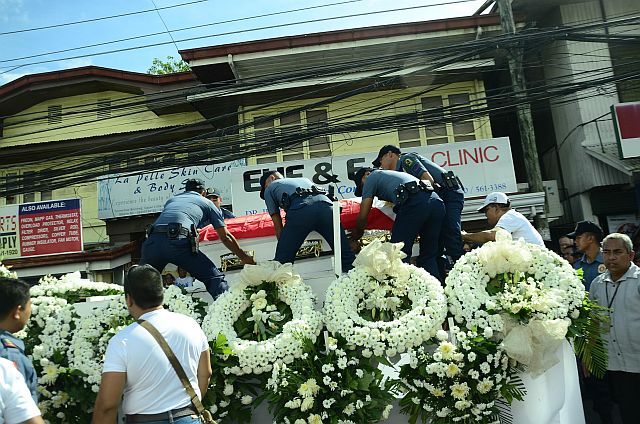 The casket bearing the remains of former Leyte Rep.  Codilla is placed on a carriage before heading to Saints Peter and Paul Parish for a Requiem Mass (INQUIRER.net).