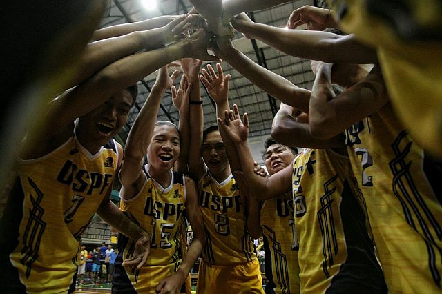 Players from the University of Southern Philippines Foundation (USPF) celebrate the championship victory over the University of San Carlos (USC) in the Cesafi boys' volleyball tournament Sunday afternoon at the USC Main gym (CDN PHOTO/TONEE DESPOJO). 