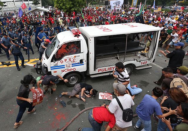 October 19 2016 A police mobile runs over protesters during a violent dispersal at the US Embassy in Manila, the group, consisting of Indegenous People calls for the alleged military crimes against them specially in the Mindanao provinces. INQUIRER/ MARIANNE BERMUDEZ