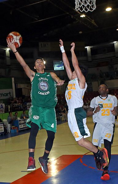 Rey Anthony Suerte  of UV goes up against Jomari Tobiano of USC in a fast break play in Game 2 of the Cesafi men’s basketball finals (CDN PHOTO/LITO TECSON).