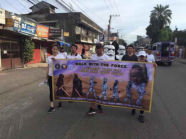CHARITY WALK. Members of the Young Lawyers Association of Cebu (YLAC) take to the streets in Star Wars’ 501st Legion costumes to raise funds for the treatment of cancer-stricken baby Jann Evou Alivio (PHOTO GRAB/FB FAGE OF ATTY. CT BACUS)