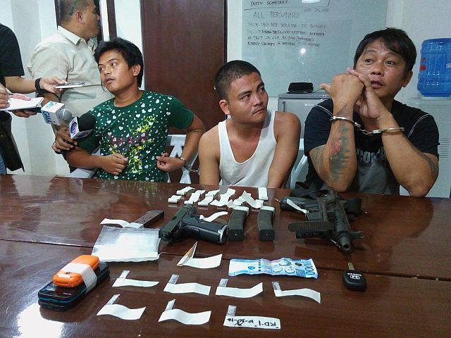 Drug suspects Eugenio Añora, Joseph Bacho and Rosendo Dominguez were presented to media along with the drugs and firearms seized from their possession by operatives of the Regional Special Operations Group (CDN Photo/Junjie Mendoza). 