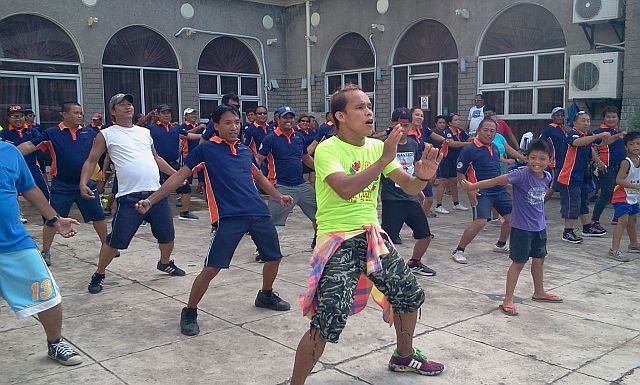 Traffic enforcers in Mandaue do regular Zumba dance exercise for them to be physically fit.  (CDN PHOTO/NORMAN MENDOZA)