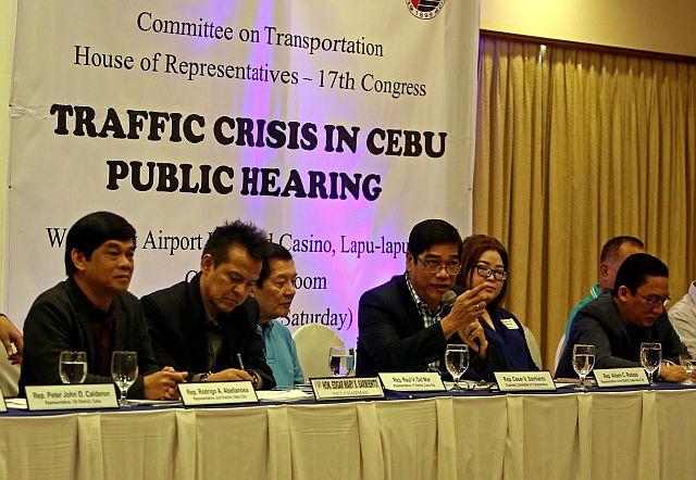 Rep. Cesar Sarmiento, House committee on transportation chairman (4th from left), leads the discussion on finding a solution to the traffic crisis in the country during a public hearing at the Waterfront Airport Hotel and Casino Mactan. Last Saturday’s public hearing was also attended by (from left) Rep. Rodrigo Abellanosa (Cebu City South district), Rep. Edgar Sarmiento, vice chairman; Rep. Raul del Mar (Cebu City north district), Rep. Aileen Radaza (Lapu-Lapu City), and Rep. Jonas Cortes (Cebu’s 6th district) (CDN PHOTO/LITO TECSON).