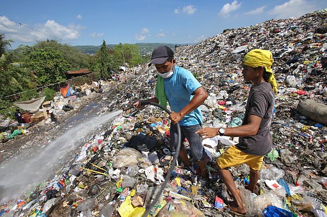 One of the interventions of the city government to mitigate the smell of the garbage in the Inayawan landfill is to spray enzymes at the mountains of garbage dumped there. (CDN FILE PHOTO)