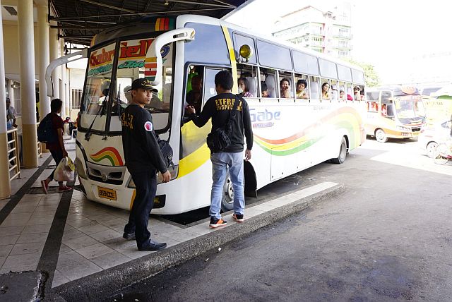 Land Transportation Office and Land Transportation Franchising Regulatory Board agents inspect passenger buses at the Cebu South Bus Terminal, an operation which they called Oplan Ligtas Biyahe (CDN PHOTO/CHRISTIAN MANINGO). 