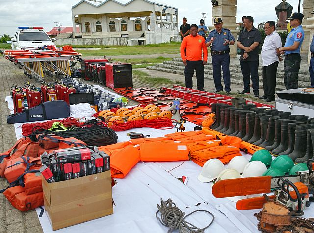  Cebu City Disaster Risk Reduction and Management Office (CCDRRMO) officials  show to P/Chief Supt. Noli Taliño (2nd from left), PRO-7 director, various equipment for search and rescue operations being readied for supertyphoon Lawin during an  inventory conducted yesterday  in front of SUGBU building at the  South Road Properties (SRP) (CDN PHOTO/JUNJIE MENDOZA).