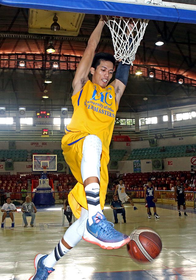 Simple two-handed slams earned high scores due to questionable rules in the CESAFI Slam Dunk contest, denying basketball fans the thrill of more difficult, acrobatic dunks (CDN PHOTO/LITO TECSON).
